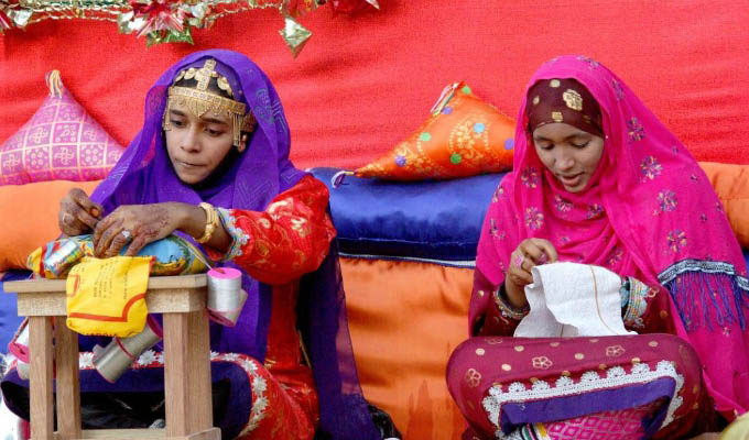 Oman - Local girls with traditional colorful dresses