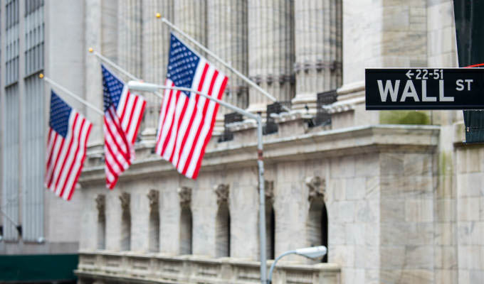 Wall street sign with New York Stock Exchange background © vichie81/Shutterstock - New York